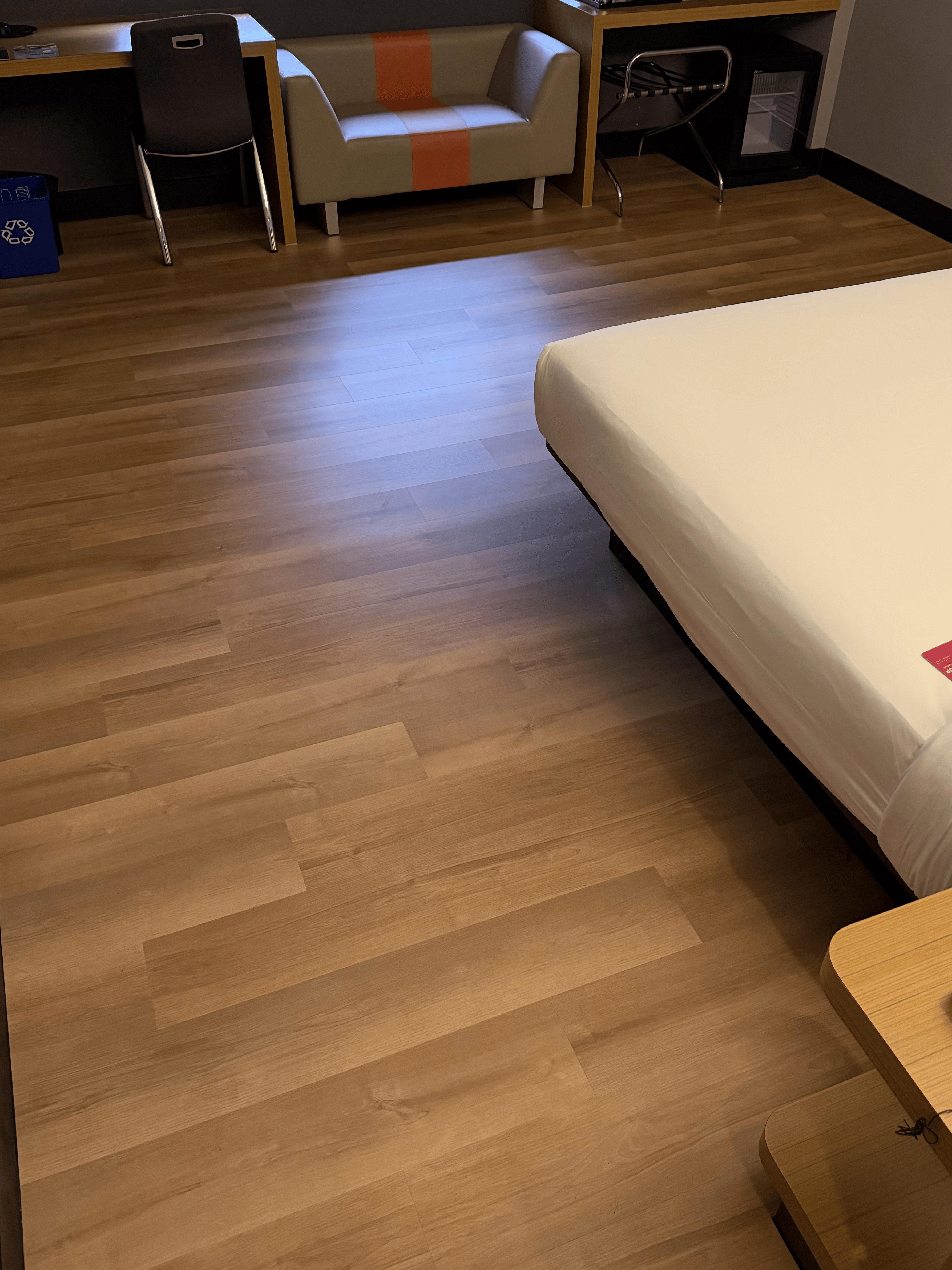 Completed commercial room with SPC flooring by Weehome